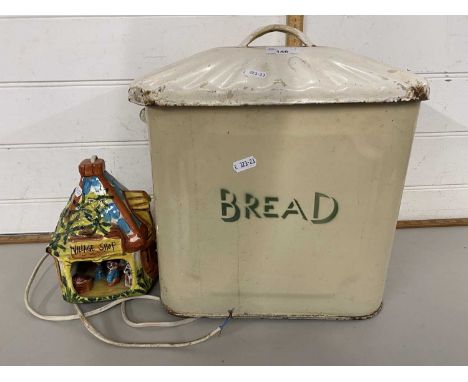 Vintage enamel bread bin and a small village shop lamp