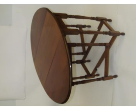 Early 20th century oak drop leaf gate leg table, oval top above turned supports and feet, height 72cm, length 103cm, width 70