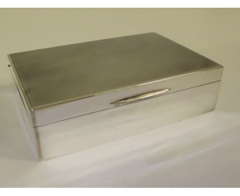 Silver cigarette/cigar box, the hinged lid with engine turned decoration, Birmingham, 1963, William Neale & Son Ltd, weight 7