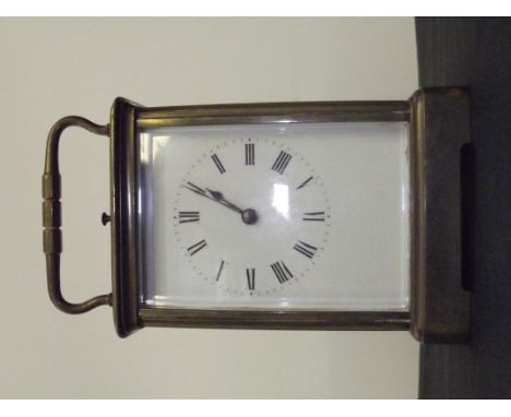 Early 20th century brass carriage clock, striking on a gong French movement stamped 'Brevettee S.G.D.G', contained within a M