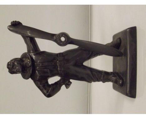 Art deco patinated table cigarette lighter in the form of a pilot (Biggles?), height 27cm