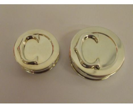 "His & Hers" Cartier sterling silver "C Logo" round pill boxes with original boxes and sleeves 4.2 / 3.5cm diameters. Both wi