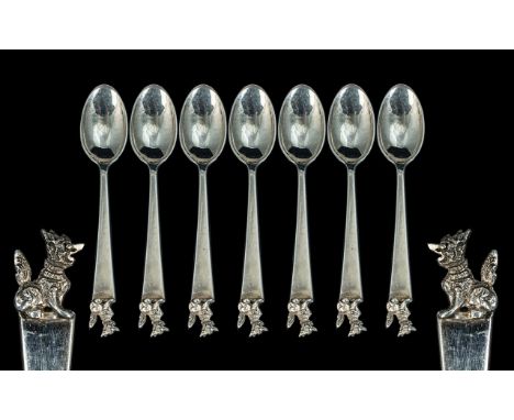 A Set of Seven Chinese Silver Spoons, with dog of Foo finial, unmarked, tests silver.  Weight 131 grams.