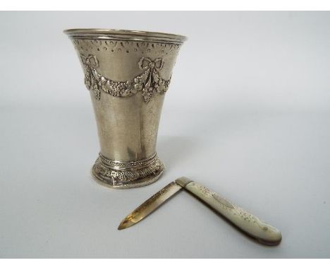 A small Swedish silver vase with repousse decoration, 1904, approximately 9 cm (h) and 66 grams / 2.1 ozt and a George V moth