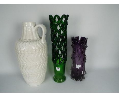 Two art glass vases to include one of reticulated form and a large white glazed ceramic ewer, largest approximately 50 cm (h)