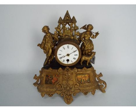 A figural mantel clock, Roman numerals to a 3" enamel dial.