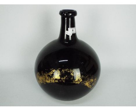 A 19th century, amethyst glass, apothecary carboy / demijohn of bulbous form, some remnants of the gilt labeling remain, appr