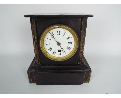 A French black slate and marble mantel clock with Roman numerals to a 3½" enamel dial, approximately 22 cm (h).