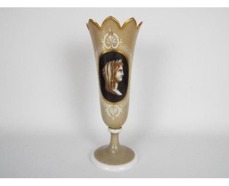 A late 19th century glass vase decorated with a classical figure in profile with Greek key border, gilt highlights and shaped