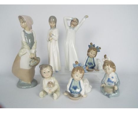 Seven Spanish porcelain figurines by Nao, largest approximately 24 cm (h). [7]