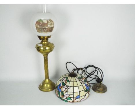 A brass column oil lamp with white shade, approximately 71 cm (h) including chimney and a Tiffany style ceiling light. [2]