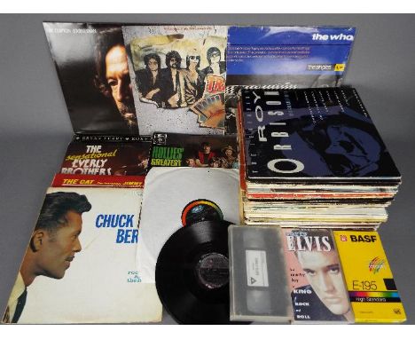 A quantity of 12" vinyl records to include The Traveling Wilburys, Chuck Berry, Jimmy Smith, The Beach Boys, Dusty Springfiel