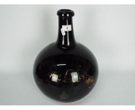 A 19th century, amethyst glass, apothecary carboy / demijohn of bulbous form, some remnants of the gilt labeling remain, appr