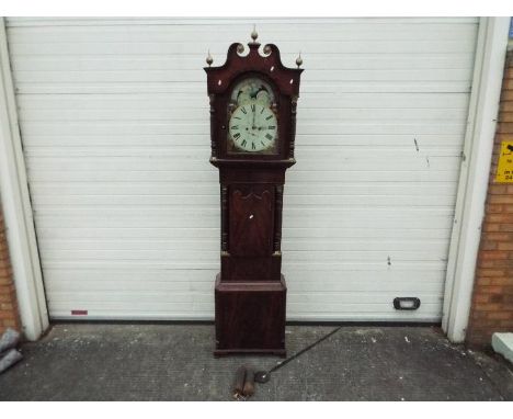 A good 19th century 8-day longcase clock signed to the 14 inch arched, rolling moon dial for Taylor of Manchester, dial in ex