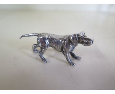 A well modelled silver dog, marked 925 maker RM - 6.5cm long - approx 1.2 troy oz 