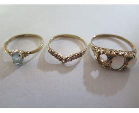 Three 9ct yellow gold rings, opal stone missing to one, total weight approx 5.2 grams 