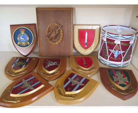 A Parachute Regimental ice bucket in the form of a drum together with eight Regimental insignia plaques on shield backs, toge
