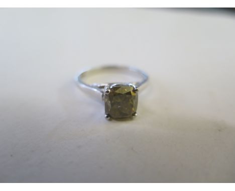 An impressive fancy coloured diamond solitaire ring, hallmarked 18ct white gold, the diamond approx 3.05ct, calculated, light