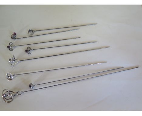 Eight Charles Horner silver topped hat pins of different designs, including one with a blue enamel flower, longest approximat