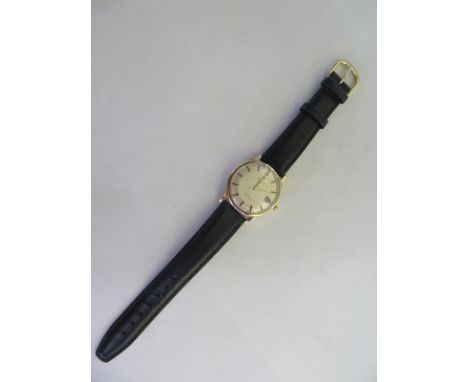 A 9ct yellow gold gents Omega Geneve manual wind wristwatch with date, 35mm wide including winder running, minor spotting to 