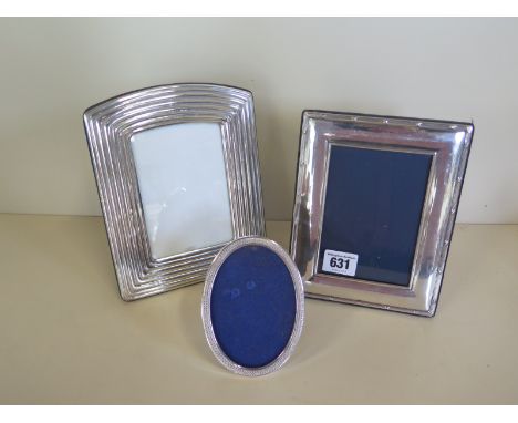 Three silver photo frames, largest 20cm x 16cm, some usage marks, glass missing to oval, otherwise good 