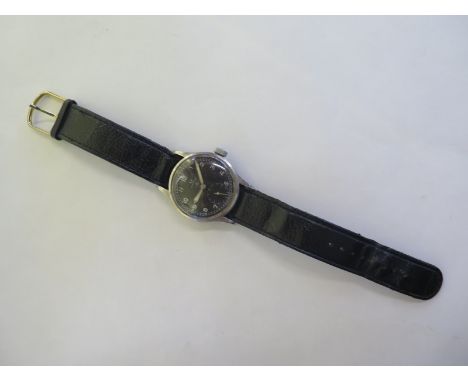 An Omega Military manual wind gents wristwatch, with stainless steel case, black dial and secondary dial case stamped WWW abo