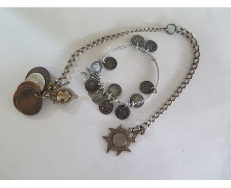 A silver watch chain and a bangle with silver three penny pieces 