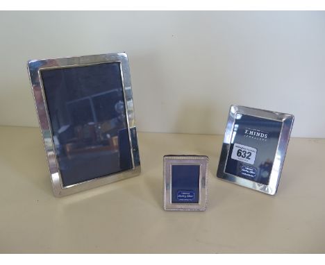 Three silver photo frames, largest 17cm x 12cm, all good, some small usage marks 