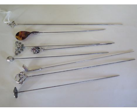 Five silver topped hat pins with three others in white metal, longest 27cm long, shortest approximately 18cm, please sele ima