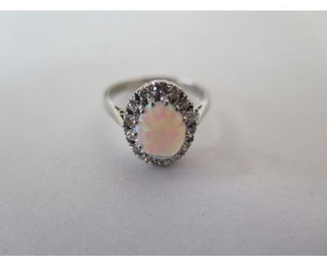 An 18 ct white gold and opal ring, ring size M/N, approximately 4.1 g 