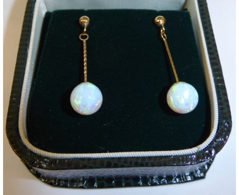 A pair of 9ct gold Pendant Earrings each set with a single opal.