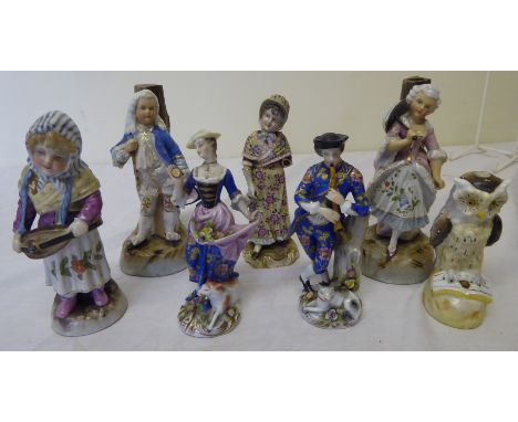 A German pottery Figure of a woman playing a hurdy gurdy, 6" (15cms) high, and six other continental Figure ornaments (a/f).