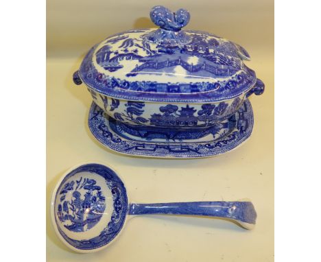 A Ridgways Sauce Tureen printed with the figures on a bridge pattern in blue and white complete with cover, stand and ladle. 