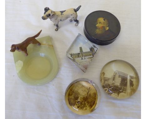 A 19th Century circular papier mache Snuff Box, the cover decorated with the head of a man, three glass paperweights, cold pa