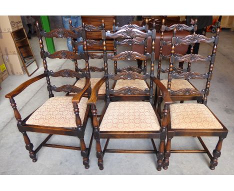 A set  of six antique design oak Dining Chairs with carved ladder backs, drop in seats, turned and block supports (two carver