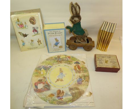A circular Panel painted with Beatrix Potter figures.  11 1/2" (29cms) diameter, six Beatrix Potter Centenary edition books, 