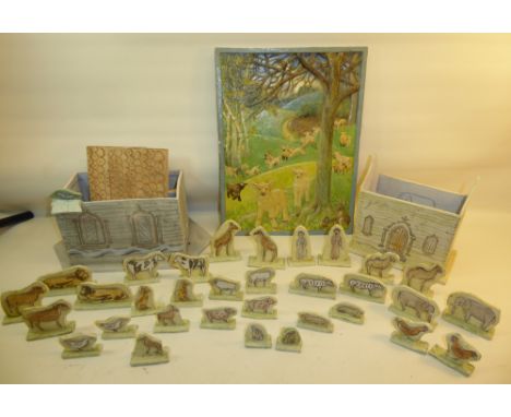 A Studio Pottery Noah's Ark by the Running Hare Pottery containing various animals; a pottery Model of a Church, and a potter