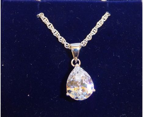A silver cubic zirconia Pendant on a fine link rope twist neck chain.