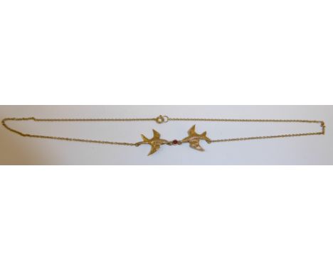 A gold Pendant formed as two swallows on a fine link neck chain.
