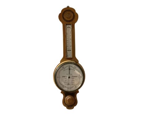 The Wilson Forecast Barometer - 20th century oak cased aneroid barometer with a white dial reading atmospheric pressure from 