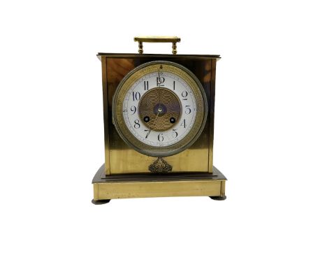 French - brass cased 19th century 8-day mantle clock, flat top with carrying handle, rectangular case on a shaped base, two p