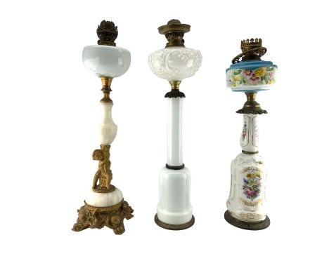 Victorian opaque glass and brass oil lamp with floral painted decoration, later converted to electricity, another opaque glas