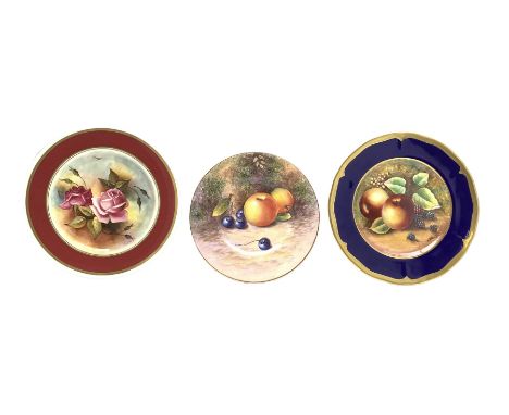 Cabinet plate painted with fruit by James Skerrett with a dark blue and gilt border D28cm, another by the same artist painted