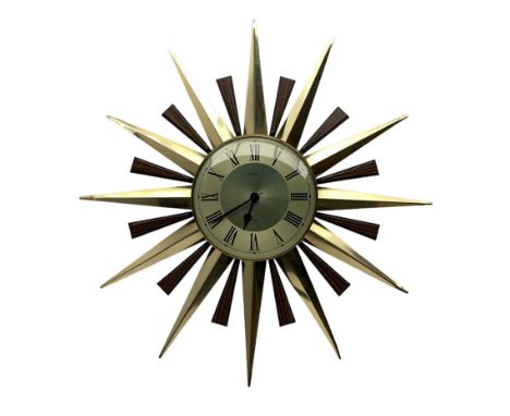Mid 20th century Metamec sunburst wall clock, quartz movement, with brass and simulated rosewood rays, D60cm overall, dial D2