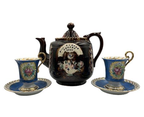 Victorian barge ware teapot  with a raised pattern of leaves and a basket of flowers inscribed 'Miss B Cook, Thorne 1880' H20