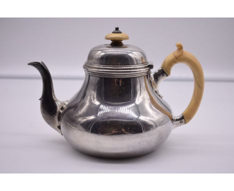 A Victorian silver teapot, by R &amp; S Garrard &amp; Co, London 1850, having ivory handle and finial, 724g all in.