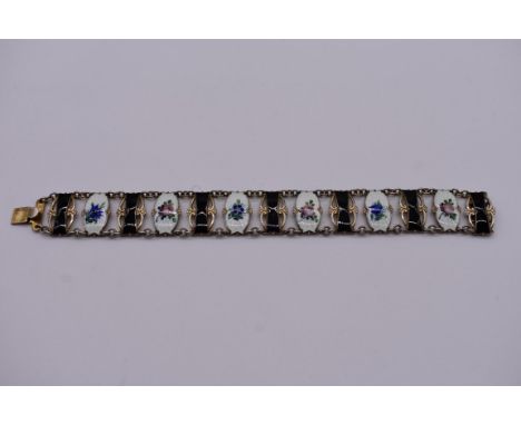 A Norwegian silver gilt and enamel bracelet, by Ivar T Holth, having alternating black and floral enamel panels, 19cm, 28g. 