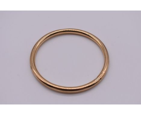 A gold slave bangle, hallmarked 375, 8g.
