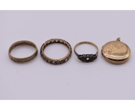 Two gold gem set rings, hallmarked 375; together with an unmarked eternity ring; and a 9ct gold back &amp; front locket. (4) 