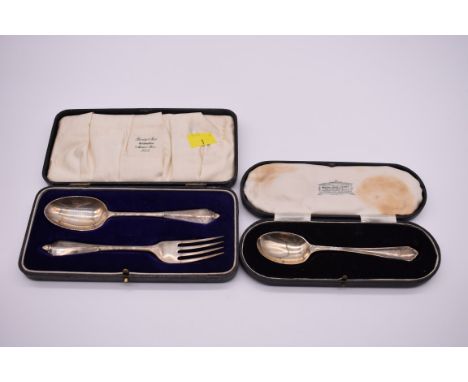 A cased silver Christening fork and spoon, makers mark indistinct, Birmingham 1931; together with a cased silver spoon, 100g.